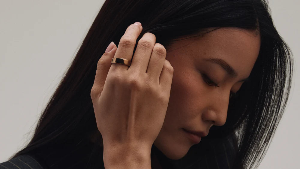 The Oura Ring, a screen-free health wearable, worn on a finger