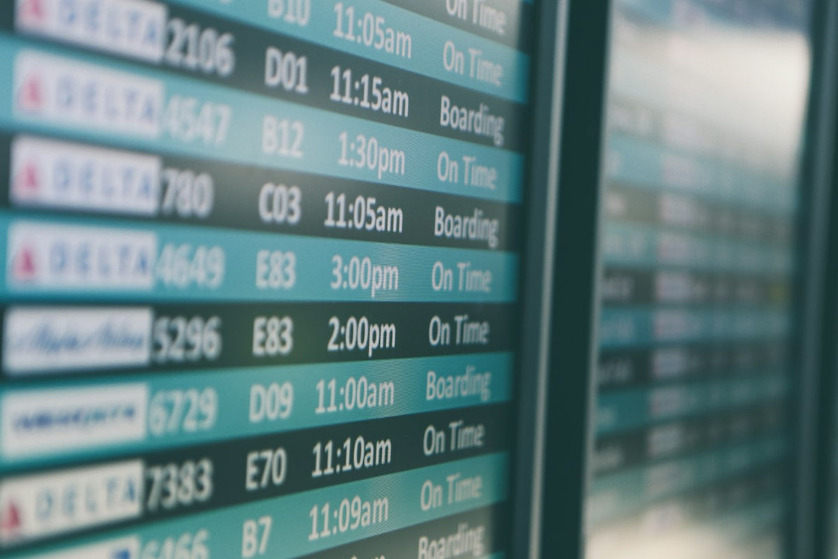 An airport departure board, the kind of errand both of these agents promise to handle for you