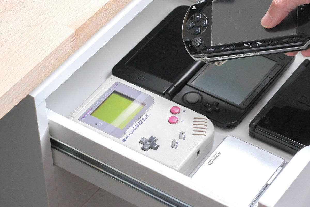 A row of handheld gadgets set aside, the fate of most devices bought to fix a habit
