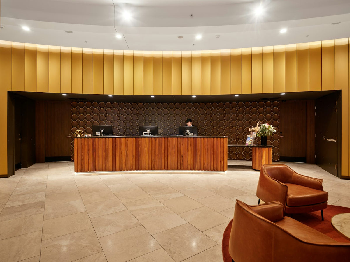 A hotel reception desk, the concierge job an agentic assistant is built to imitate
