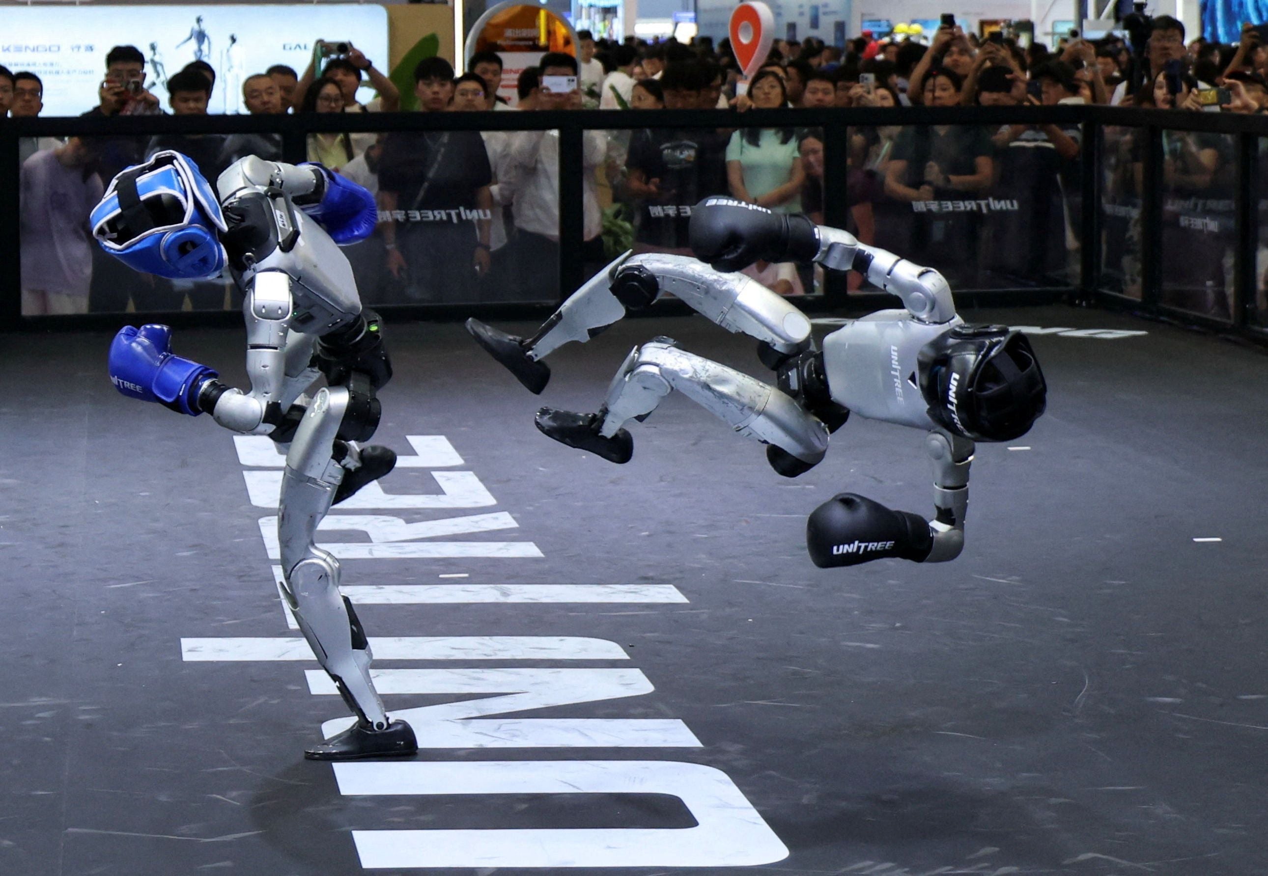 Unitree humanoid robots at the 2026 World Robot Conference, the week the company debuted on Shanghai's STAR Market. Photo via Semafor