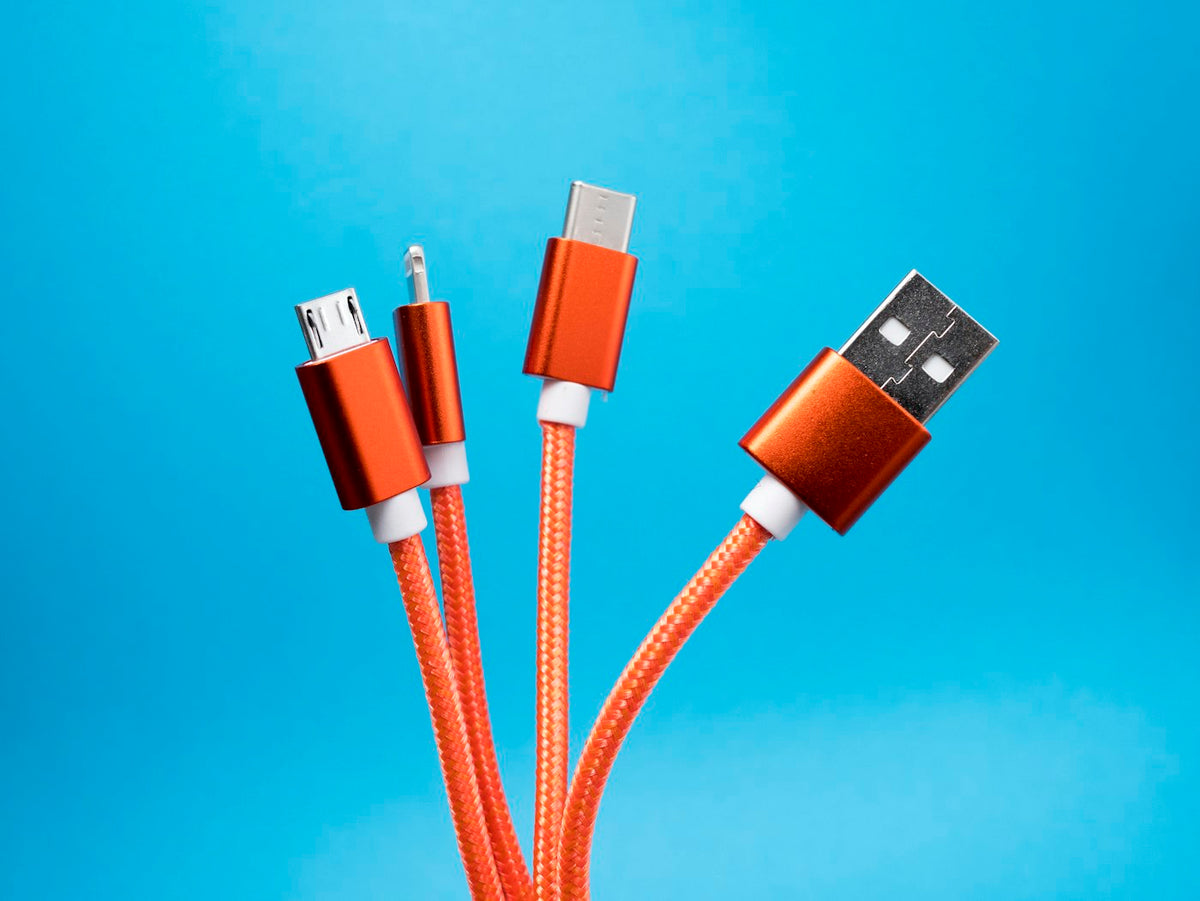 USB charging cables coiled together, the spec every AI pendant maker measures differently