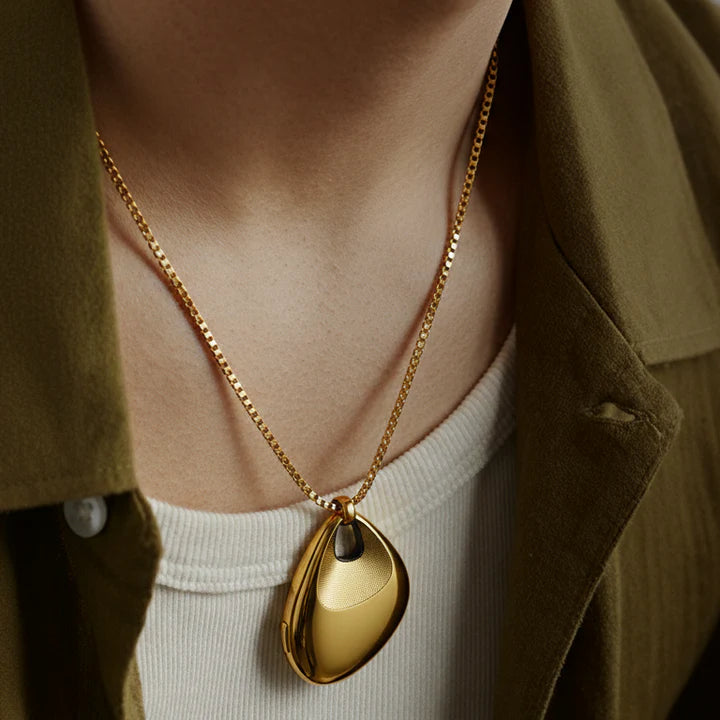 legend gold pendant close up